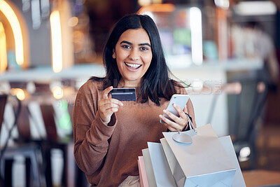 Buy stock photo Portrait, bags and woman with credit card, smartphone and shopping with boutique clothes, retail and shopping. Face, female person and customer in a store, smile and cellphone with payment and sales
