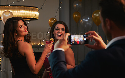 Buy stock photo Photography, phone and women at party with friends, drinks or happy celebration together at social event. Smile, smartphone and people with digital memory, cocktail and fun energy at luxury nightclub