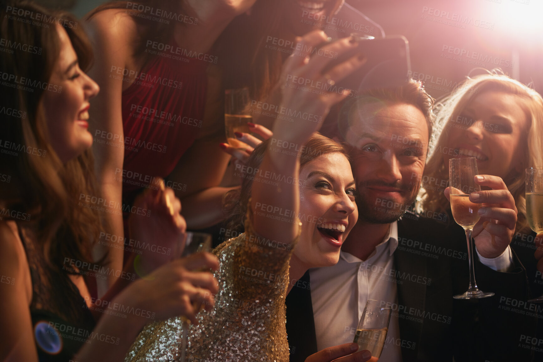 Buy stock photo Selfie, party and new year with friends in a nightclub posing for photograph of celebration together. Champagne, toast and nightlife with a group of people taking a picture in a club while dancing
