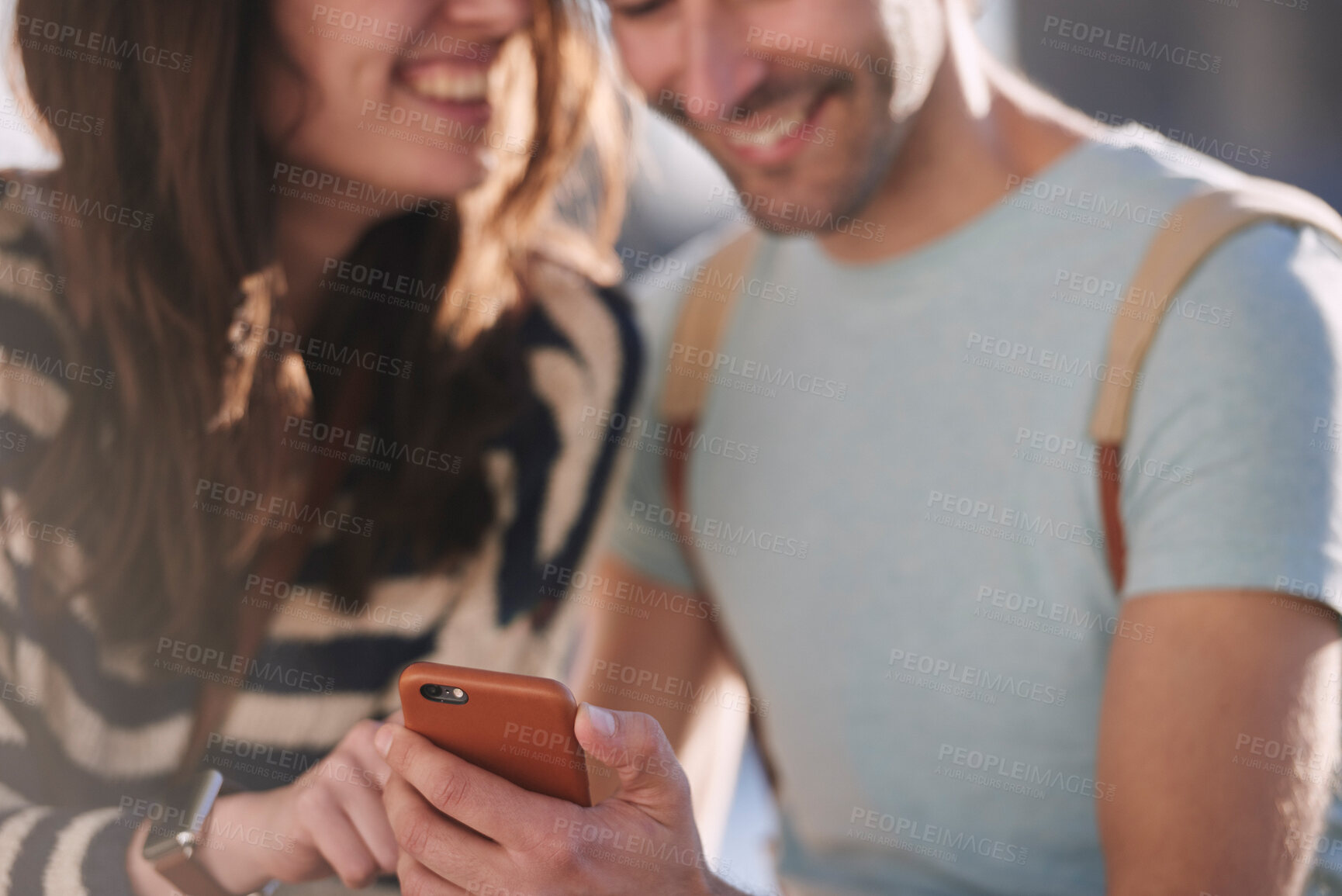 Buy stock photo News, phone and couple networking on social media to share global gossip content for entertainment in a city. Smile, man and happy woman enjoy funny or crazy online conversation on a social network