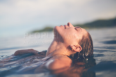 Buy stock photo Ocean, swimming and woman with holiday, sea and relax with getaway trip, freedom and outdoor for fun. Person, traveller and girl with vacation, water and summer with weekend break, carefree or travel