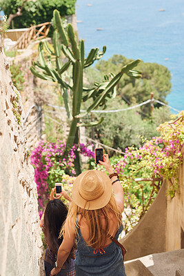 Buy stock photo Friends, travel or women taking a selfie on holiday, vacation or weekend trip for quality time bonding. Flowers, mobile photography or back view of girls taking pictures on fun adventure in summer 