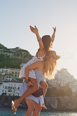 Buy stock photo Vacation piggyback, free and women in summer for freedom, city adventure and walking in Spain. Smile, travel and young friends being carefree together on a holiday in a small town by the ocean