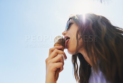 Buy stock photo Summer, below and a woman with ice cream on a blue sky for freedom, travel and sweet food. Sun, holiday and a young girl with a dessert during a vacation in spring or a eating gelato and thinking