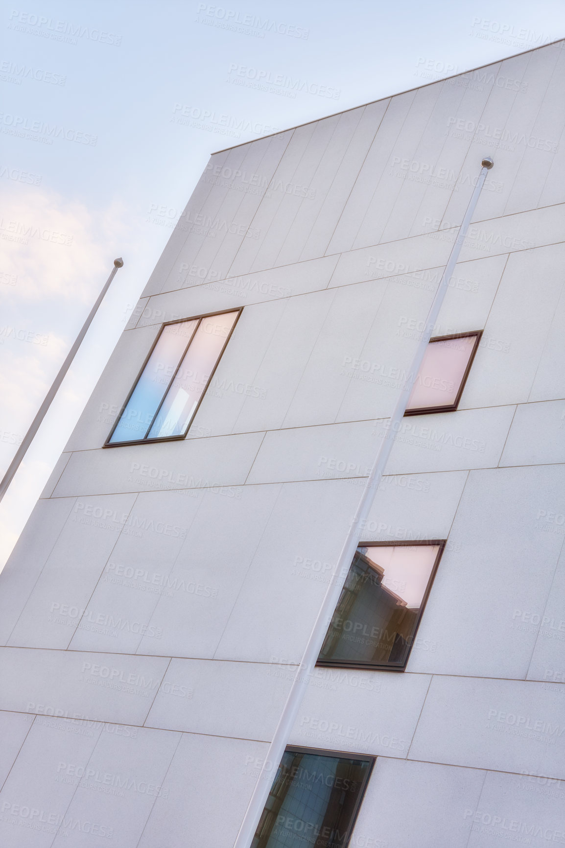 Buy stock photo Building, glass windows and architecture with construction in city below for industrial development or infrastructure. Low angle, structure or architectural with exterior detail in an urban suburb