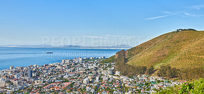 Buy stock photo Panoramic shot of a coastal city at the bottom of a hill. The central business district of Cape Town, South Africa, A picturesque horizon showing both land and city, as well as a commercial area