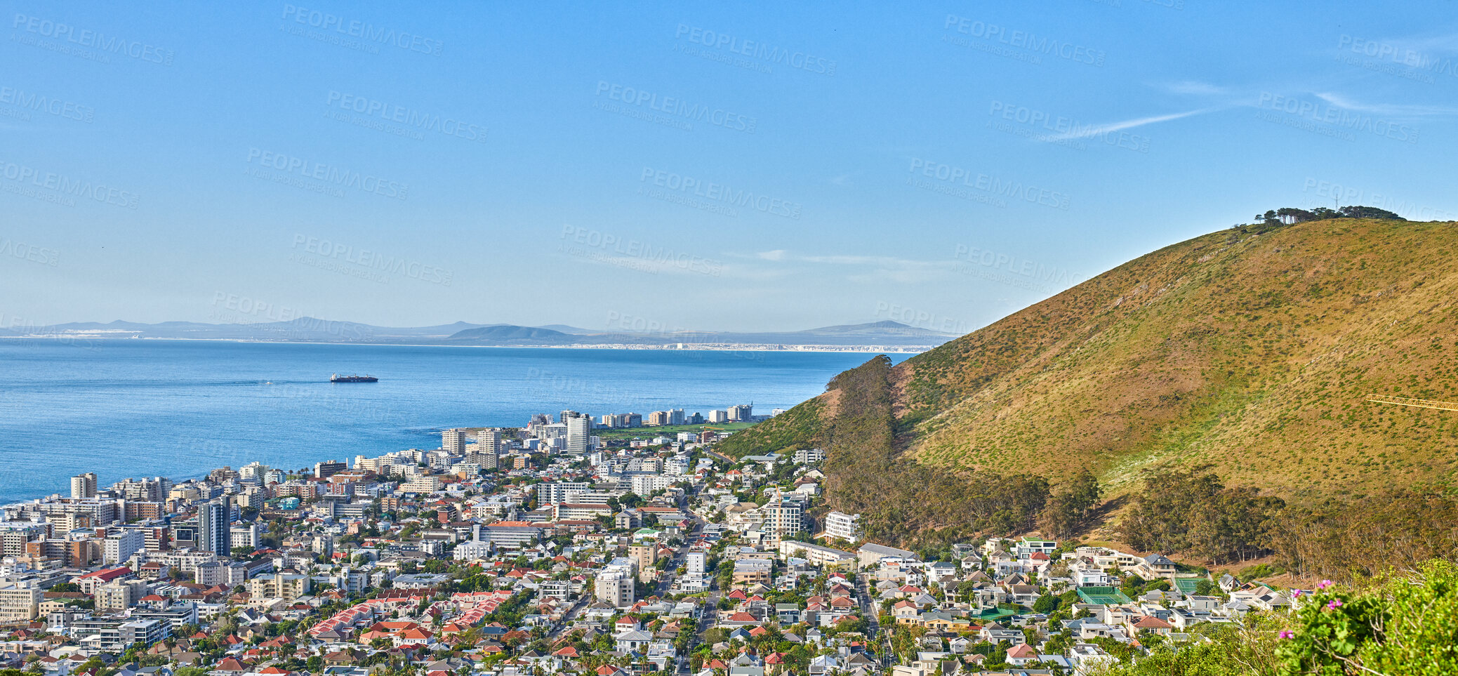 Buy stock photo Panoramic shot of a coastal city at the bottom of a hill. The central business district of Cape Town, South Africa, A picturesque horizon showing both land and city, as well as a commercial area