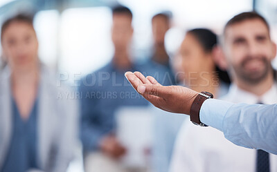 Closeup hand of unknown african american business manager training and presenting to team of businesspeople in office workshop. Black businessman talking and teaching group of professional colleagues