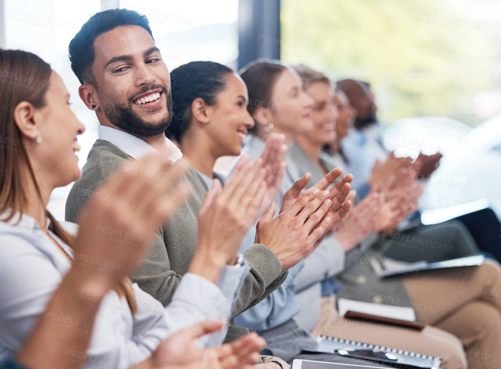 Buy stock photo Diverse group of smiling businesspeople clapping in office training. Team of professional colleagues cheering and celebrating together while learning in workshop. Attending a seminar for marketing