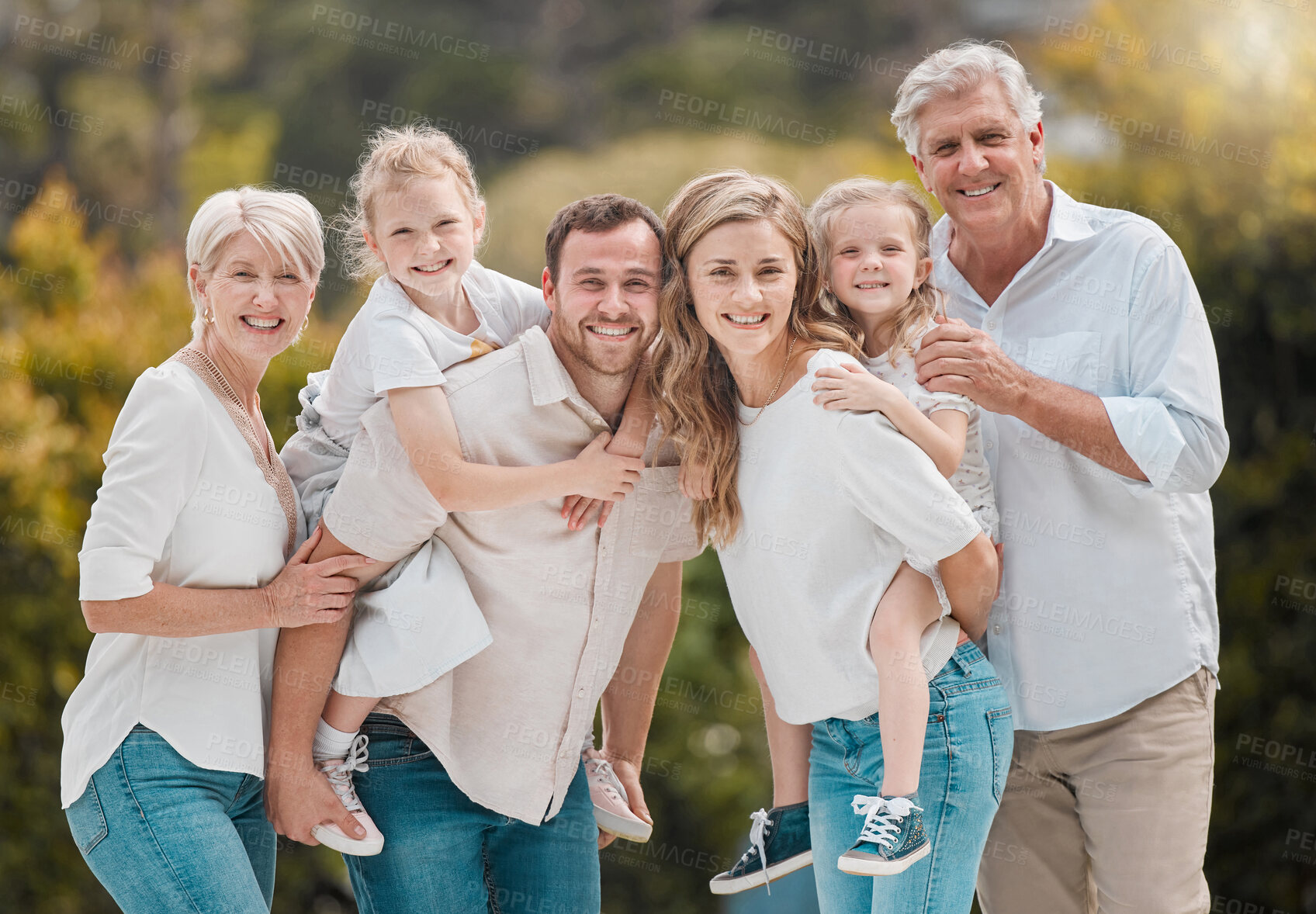 Buy stock photo Portrait of grandparents, parents and kids in park with smile, big family and piggy back in backyard. Nature, happiness and men, women and children in garden with love, support and outdoor bonding.