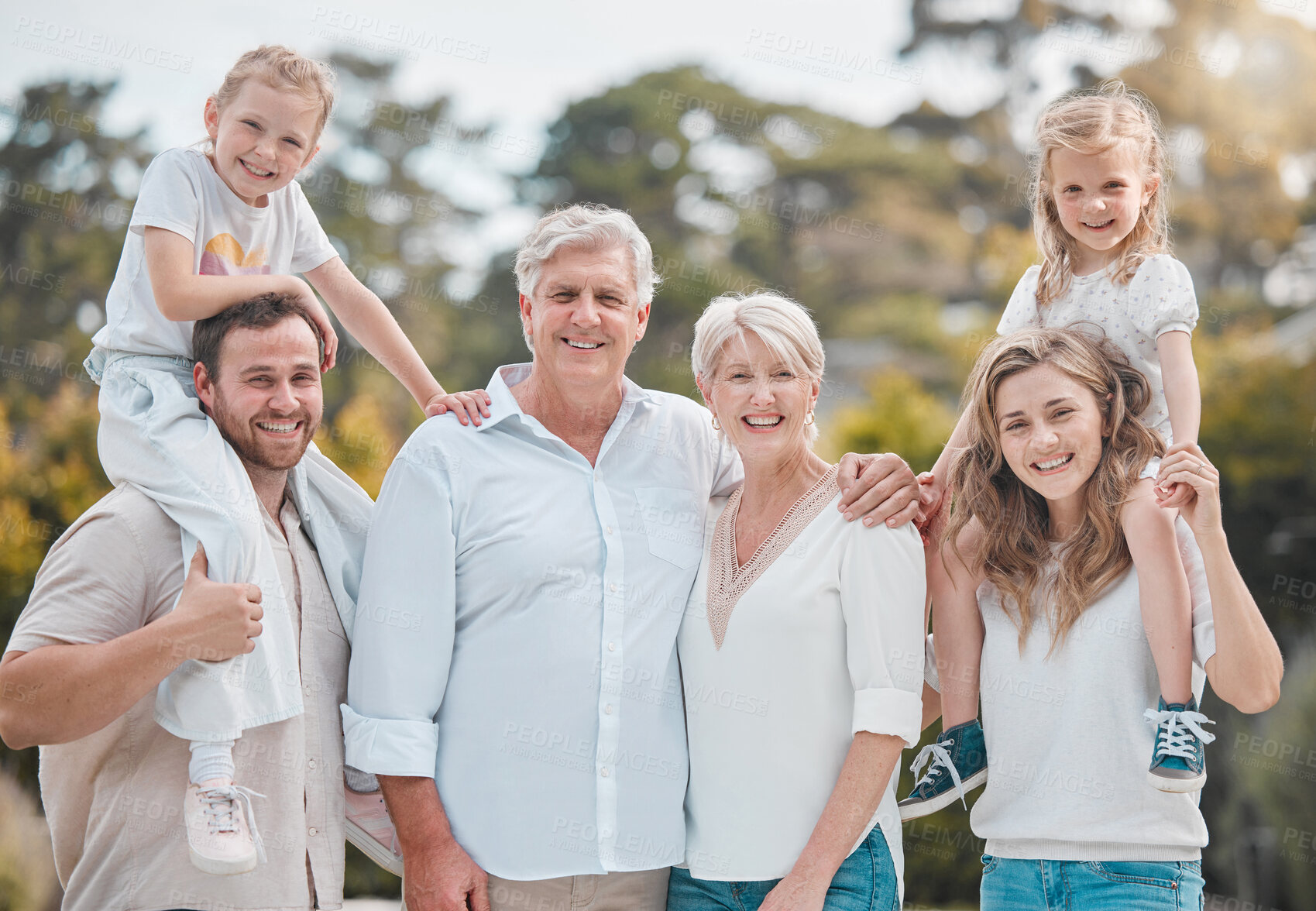 Buy stock photo Portrait of big family in nature with piggy back, grandparents and parents with kids in backyard. Trees, happiness and men, women and children in garden with love, support and outdoor bonding in park