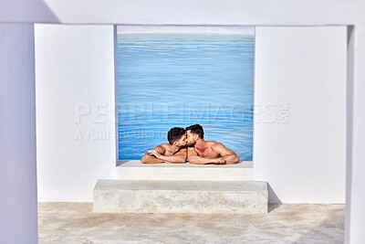 Two nude caucasian muscular gay men kissing passionately while swimming in a clear blue pool on a sunny day outdoors. Young handsome homosexual couple in love sharing an intimate moment together