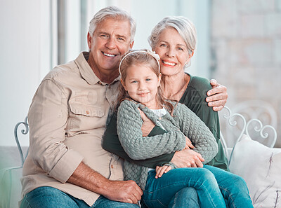 Buy stock photo Grandparents, hug and portrait on couch with girl, care and bonding with love, retirement and home living room. Happy old man, elderly woman and embrace child in lounge, relax and pride in apartment