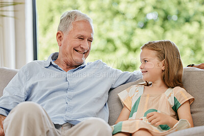 Buy stock photo Conversation, smile and grandfather with child on a sofa bonding, relaxing and talking at home. Happy, family and senior man speaking to young girl kid on a couch in the living room at modern house.