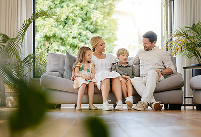 Buy stock photo Smile, happy and children with parents on a sofa relaxing in the living room of modern house. Bonding, love and young kids relaxing, resting and sitting with mother and father in the lounge at home.