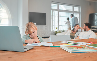 Buy stock photo Serious young little girl writing in a notebook doing her home work while sitting at a table in the lounge at home. Small caucasian child focused on drawing in a book while using a laptop