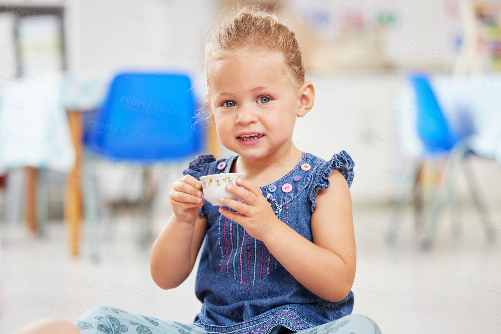 Buy stock photo Portrait, kid or little girl with tea cup in kindergarten, daycare or classroom for playing. Youth, happy and smile for fun activity with delicious, fresh and beverage for development of motor skills