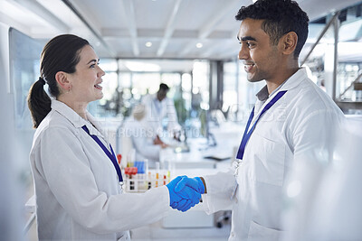 Buy stock photo Science, handshake and man with woman in laboratory for agreement, deal or onboarding. Teamwork, medical research and scientist shaking hands in partnership, collaboration or introduction for doctors