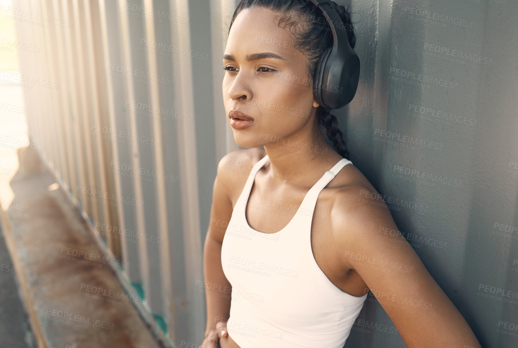 Buy stock photo Fitness break, breathe or woman running in city listening to music, podcast or radio playlist in sports exercise. Wellness, headphones or tired girl athlete resting after training or workout outdoors