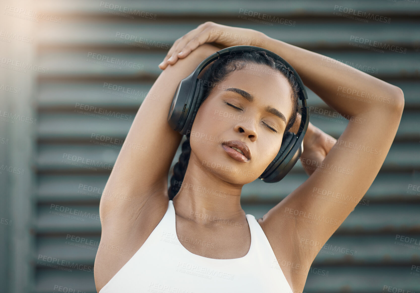 Buy stock photo Stretching, city and woman with headphones, fitness or exercise with motivational podcast, relax or stress relief. Female person, athlete and girl with headset, streaming music or radio with wellness