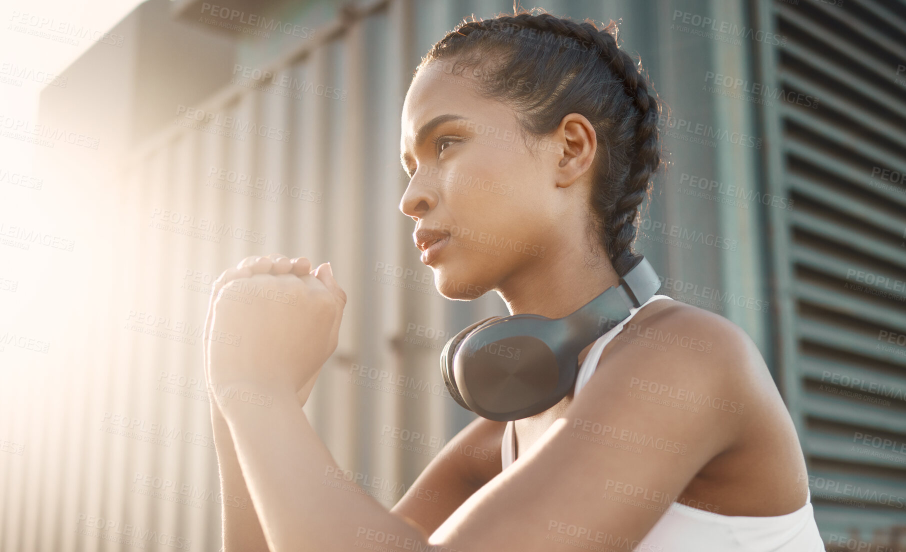 Buy stock photo Fitness, woman with headphones and training with lens flare in the morning. Workout or exercise, warm up in sportswear or healthy lifestyle and female athlete squat for cardio health wellness