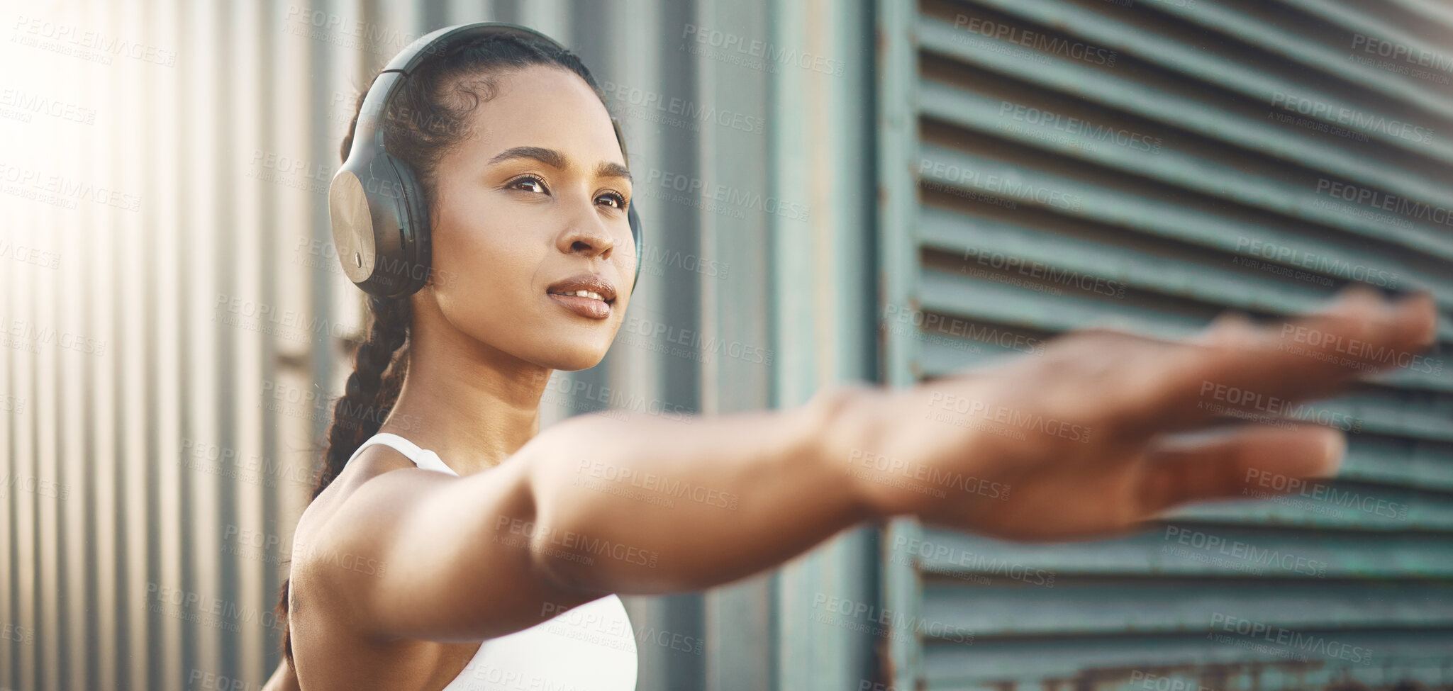 Buy stock photo Fitness, workout and woman stretching arms in city listening to music, audio and track. Sports, healthy body and female person outdoors with headphones for exercise, training and warm up for running