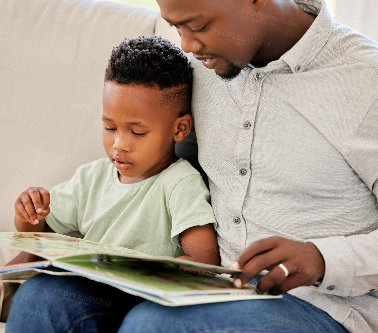 Buy stock photo Father, reading and child with book in home on sofa with development of education, learning and knowledge. Happy dad, teaching and show kid storytelling in books and relax in living room on couch