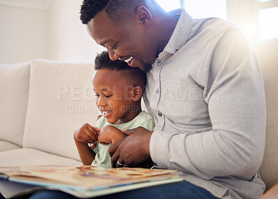 Buy stock photo African, father and child in home reading book on sofa with development of language, education and learning. Happy dad, teaching and show kid a storytelling in books and relax in living room on couch