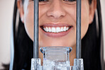 Closeup of a woman getting a digital x-ray scan of her mouth at the dentist. One female only smiling for a dental checkup. Patient taking care of her oral hygiene to maintain healthy teeth and gums