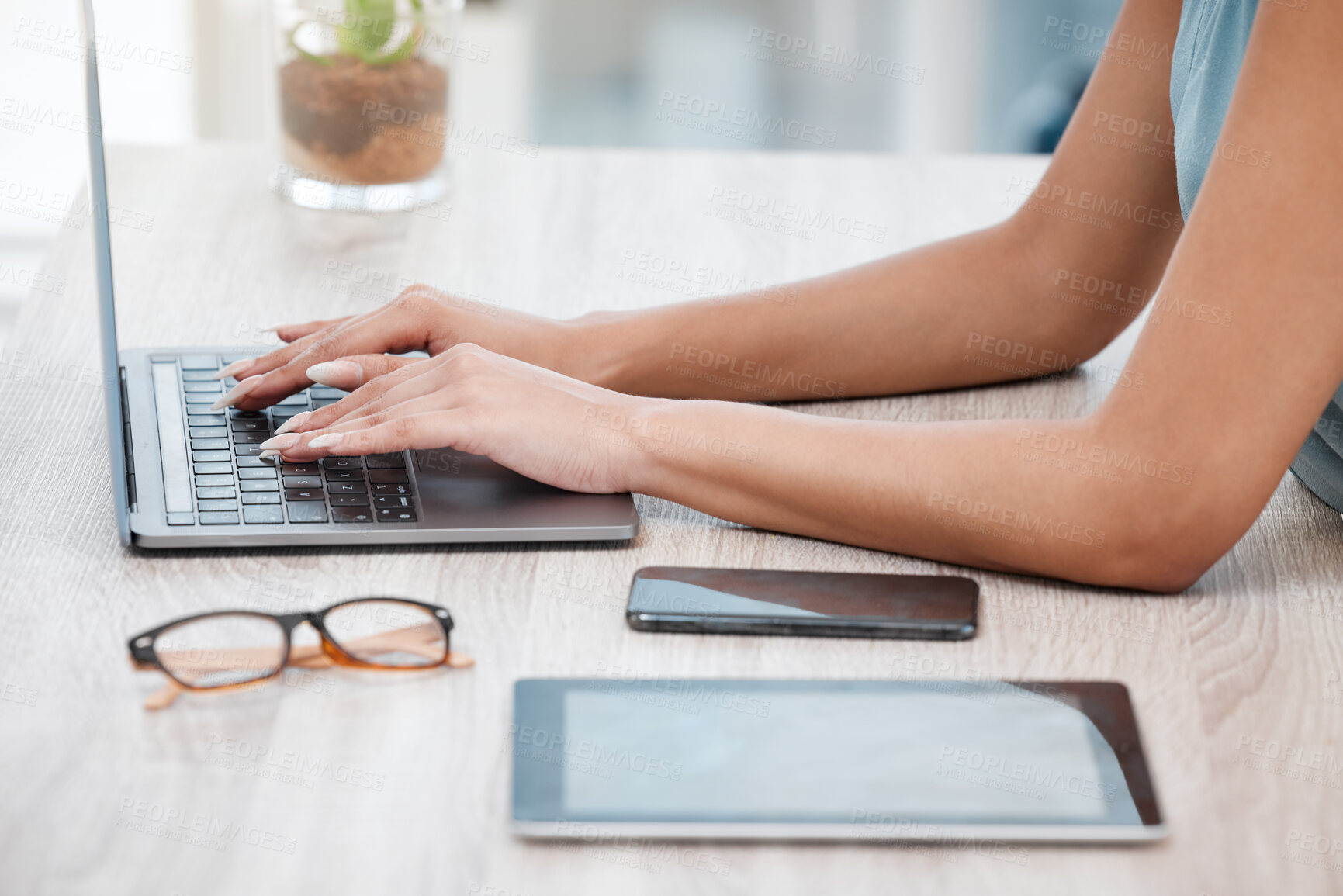 Buy stock photo Hands, laptop and a business woman at a desk in her office for communication, networking or report. Phone, tablet and glasses with an employee typing an email closeup in a professional workplace