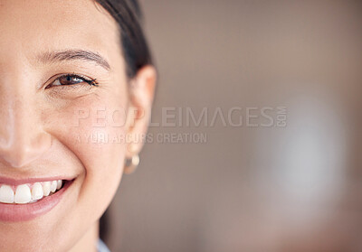 Closeup portrait of a mixed race unrecognizable woman eye with perfect eyebrows and natural looking eyelash extensions while standing in an office