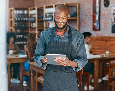 Buy stock photo Restaurant, tablet and happy man or small business owner, e commerce and online cafe or coffee shop management. Waiter or african person reading sales on digital technology or internet for startup