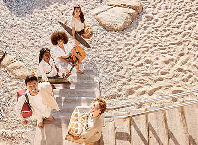 Buy stock photo A overhead view of a diverse group of friends at the beach for a picnic