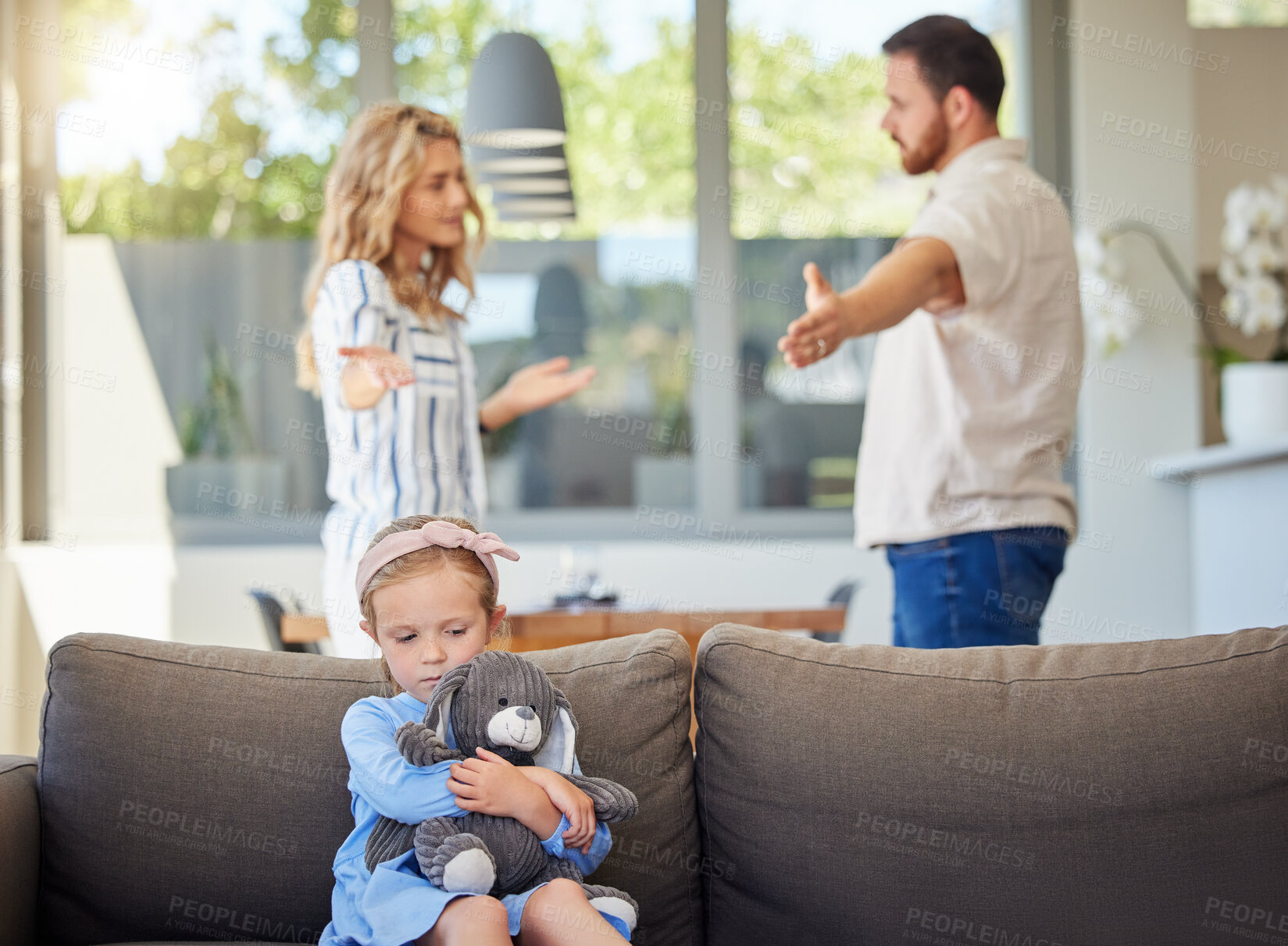 Buy stock photo Parents fight, sad child and home with divorce and angry argument of mom, dad and kid on couch. Anxiety, childhood trauma and young girl with teddy bear feeling depressed from parent marriage crisis