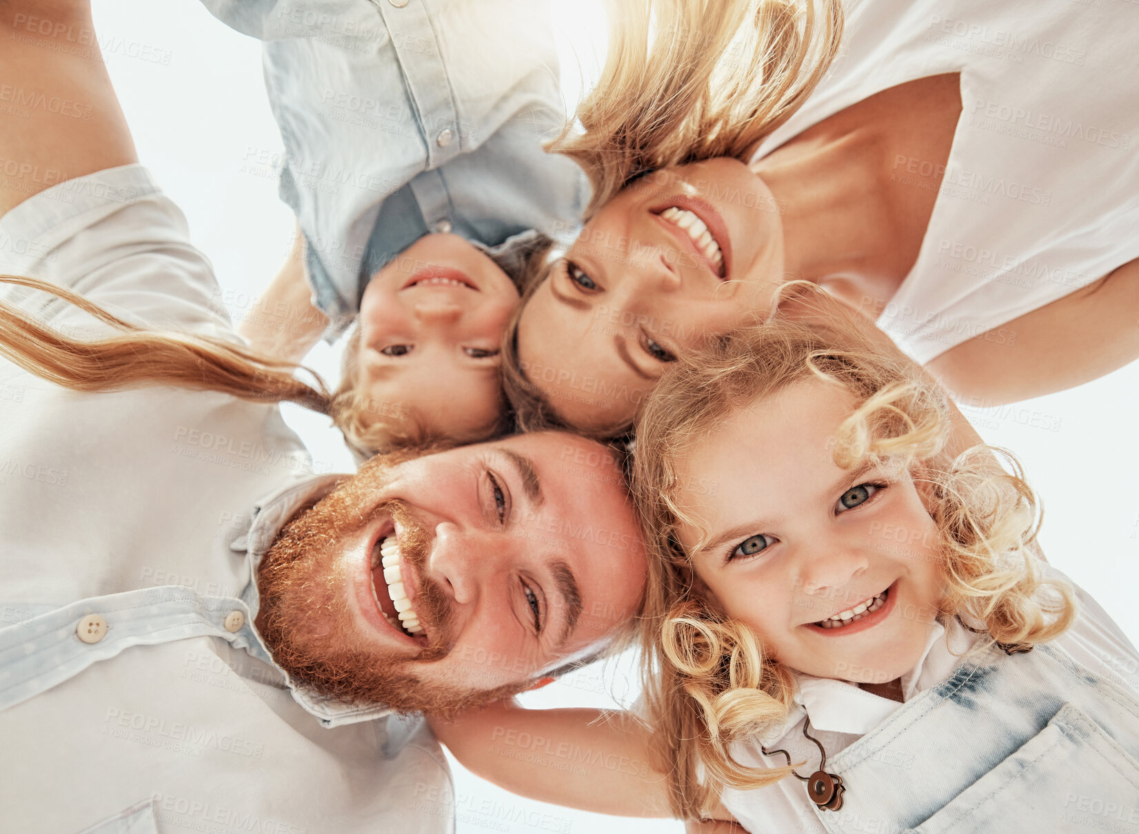 Buy stock photo Family portrait, heads together in circle from below and happiness, bonding and holiday travel to Australia. Face of mother, father and children with smile, happy outdoor huddle on summer vacation.