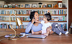 Mother working from home phone call with baby. Hispanic woman making call on smartphone. Teleworking businesswoman at home with baby. Mother holding a baby working in her study.