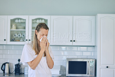 Buy stock photo Allergies, toilet paper and woman blowing her nose in the kitchen for a cold, flu or sneeze at her home. Illness, virus and young female person with tissue for sinus, hay fever or covid in apartment.