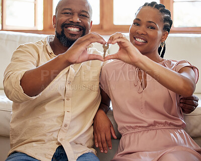 Buy stock photo Hands, heart and emoji with a homeowner black couple in their new home together after purchase or investment. Portrait, keys or real estate with a man and woman property owner proud of their mortgage