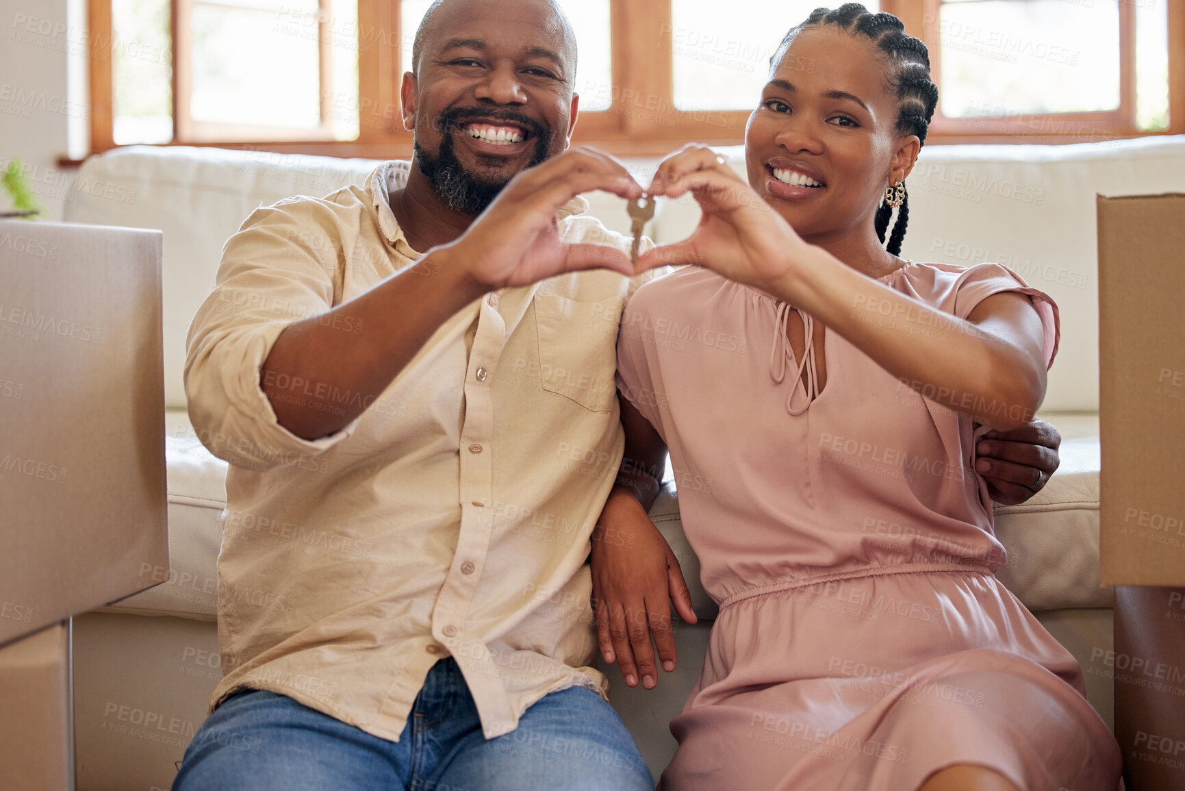 Buy stock photo Keys, heart and emoji with a homeowner black couple in their new home together after purchase or investment. Portrait, hands or real estate with a man and woman property owner proud of their mortgage