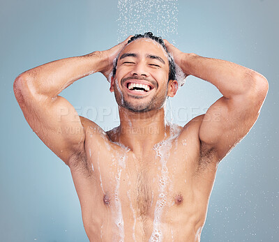 Buy stock photo Handsome hispanic man in the shower. Young man enjoying a shower in a studio. Man washing his body in the shower. Young man's bodycare routine. Happy man enjoying a hygienic shower