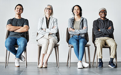 Buy stock photo Businesspeople waiting in line for interview. Patients sitting in line at doctor's office. Therapist sitting with patients in a row. Portrait of diverse businesspeople with arms crossed 