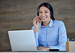 Happy business woman with headset working on laptop in office. Customer support operator answering calls. Professional wearing headset during video conference or watching webinar learning new language