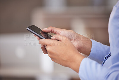 Closeup of hands of businesswoman texting. Businesswoman using a cellphone looking online. Professional entrepreneur ordering products online using her mobile phone. Businessperson using a smartphone