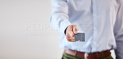 Closeup of male hands giving credit card. Business man showing credit card mockup. Making payment