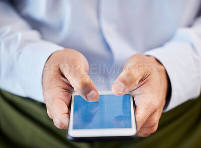 Buy stock photo Closeup of businessman browsing the internet on a cellphone in the office. Unknown mixed race professional connecting with clients and social networking. Entrepreneur scrolling schedule on technology