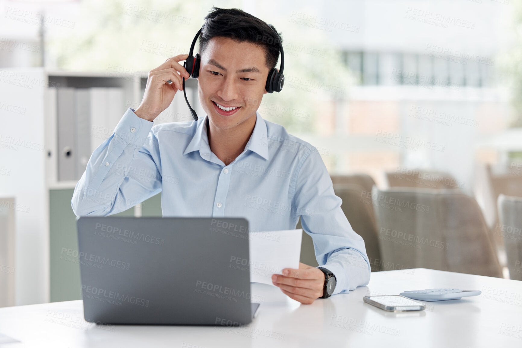 Buy stock photo Asian man, call center and laptop with document in customer service, telemarketing or support at office. Happy male person or consultant agent with paperwork on computer in online advice at workplace