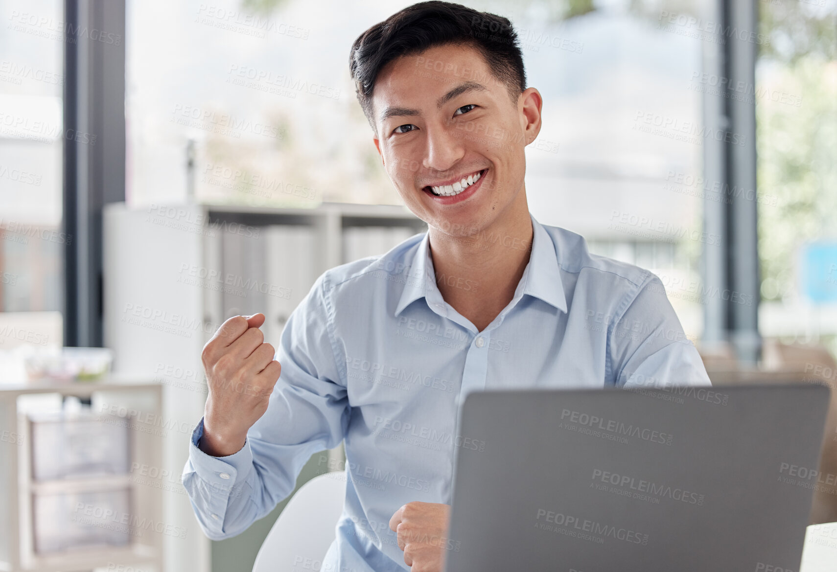 Buy stock photo Happy asian man, laptop and fist in celebration for winning, bonus or promotion at the office desk. Portrait of excited businessman by computer for good news, victory win or success at the workplace