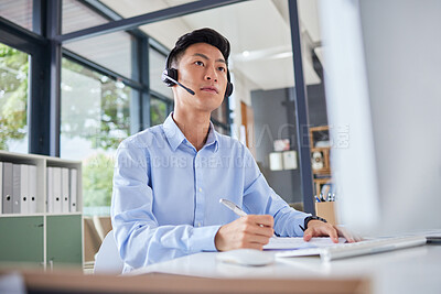 Buy stock photo Call center, writing and focus with business man in office for consulting, contact us and telemarketing. Communication, customer service and help desk with Asian employee for receptionist and advice