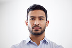 Portrait of a mixed race handsome man's face looking serious focused while standing against a white copyspace background at work in an office 