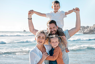 Buy stock photo Portrait of a happy caucasian family of four on vacation by the sea. Children enjoying a getaway with their parents on bright summer day, smiling family relaxed against a bright copyspace background 